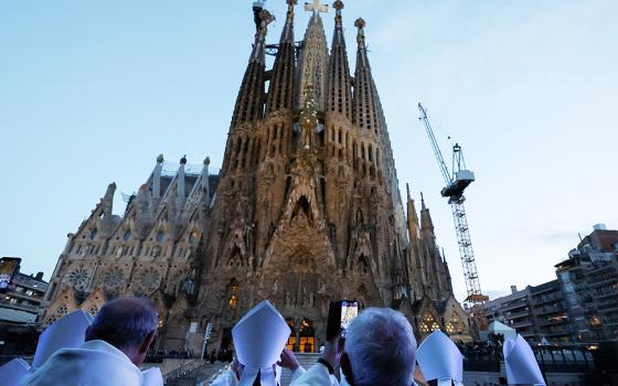 Members of the clergy stand outside the Basilica of the Sagrada Familia in Barcelona on the day of the inauguration and blessing of the Tower of Jesus Christ by Pope Leo XIV during his apostolic journey to Spain, June 10, 2026. (OSV News/Reuters/Nacho Doce)