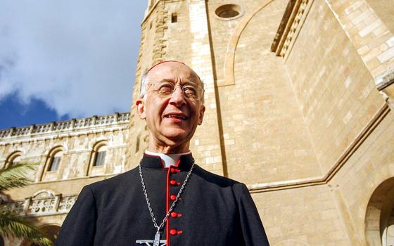 Italian Cardinal Camillo Ruini stands in the courtyard of Notre Dame Center in Jerusalem April 23, 2004. (CNS/Debbie Hill)