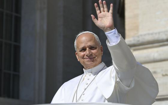 Pope Leo XIV smiles as he greets visitors during his weekly general audience in St. Peter's Square at the Vatican June 17, 2026. A day earlier, Leo spoke with journalists about the Society of St. Pius X. (CNS/Vatican Media)