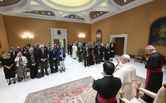 Pope Leo XIV gives a blessing after meeting with writers from around the world at the Capitolare Hall of St. Peter's Basilica at the Vatican June 24, 2026, to mark the 100th anniversary of the Holy See's publishing house, Libreria Editrice Vaticana. (OSV News/Vatican News/Simone Risoluti)