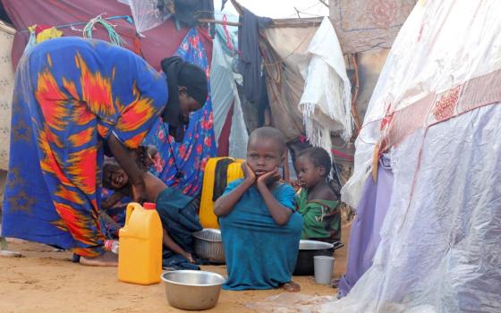 An internally displaced Somali family prepares breakfast outside their makeshift shelter in Mogadishu May 7, 2026. Experts say nearly 6.5 million people in Somalia are experiencing high levels of acute food insecurity and more than 1.8 million children are suffering from acute malnutrition because of recurrent drought, displacement, prolonged instability and insufficient resources. (OSV News/Reuters/Feisal Omar)
