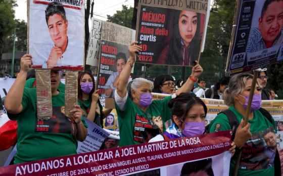Relatives of Mexico's disappeared march before the opening day of the 2026 FIFA World Cup in Mexico City, Thursday, June 11, 2026. (AP/Alejandro Cegarra)