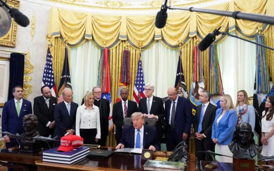 U.S. President Donald Trump speaks as the Department of Justice's Religious Liberty Commission presents a draft of its report to him in the Oval Office of the White House in Washington, June 26, 2026. (OSV News/Reuters/Ken Cedeno)