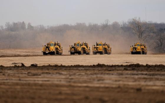 Earth movers prepare a site for a 2.5 million square foot AI data center March 24, 2026, in Independence, Mo. Globally, data centers rank behind all but 10 countries in electricity use, according to a new U.N. report. (AP/Charlie Riedel, file)