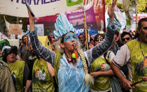 Demonstrators protest outside the Argentine National Congress building in Buenos Aires as lawmakers debate the Javier Milei government's proposal to reform Argentina's glacier protection law April 8, 2026. (AP/Rodrigo Abd)