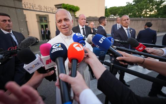 Pope Leo XIV talks to journalists as he leaves his residence in Castel Gandolfo, on the outskirts of Rome, to return to the Vatican June 16, 2026. (AP Photo/Andrew Medichini)