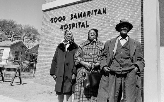 Family of Baptist Deacon Jimmie Lee Jackson are seen in front of Good Samaritan Hospital in Selma, Alabama, in February 1965, after a state trooper fatally shot Jackson during a voting rights march earlier that month. From left are Jackson's mother, Viola Jackson, his cousin Rachel Thomas and his grandfather Cager Lee. (AP/Horace Cort, File)