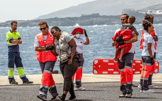 Migrants disembark at the port of La Estaca in Valverde at the Canary Island of El Hierro, Spain, Aug. 26, 2024, after a 13-day voyage by boat from the coast of Senegal. (AP/Maria Ximena)
