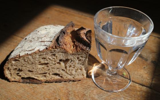 Slice of bread and a glass of water (Dreamstime/Pascal Deloche)