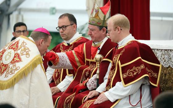 Newly consecrated Society of St. Pius X Bishop Michael Goldade is seen kissing the ring of Bishop Alfonso de Galarreta during an SSPX liturgical celebration July 1, 2026, in Écône, Switzerland. (OSV News/CPP)