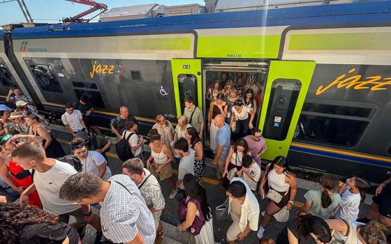 Pilgrims are seen leaving a packed train July 12, 2026, as they arrive at Castel Gandolfo, Italy, ahead of Pope Leo XIV's Sunday Angelus. (OSV News photo/Jan Guzik)