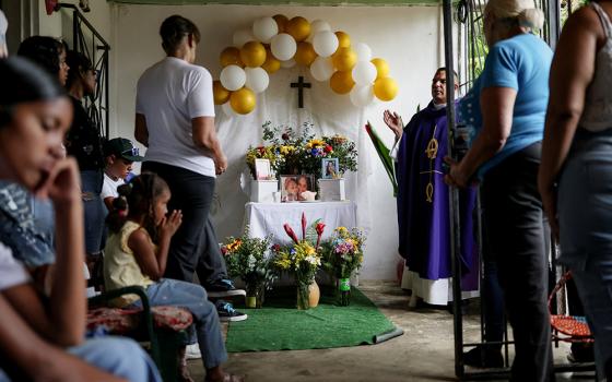 A priest celebrates a funeral Mass in La Guaira, Venezuela, July 15, 2026, for 2-year-old Kalani Martinez and her mother, Ashley Martinez, 29, victims of the earthquakes. Two catastrophic earthquakes hit Venezuela in quick succession June 24, leaving at least 5,000 dead with thousands still missing. (OSV News/Reuters/Pablo Sanhueza)