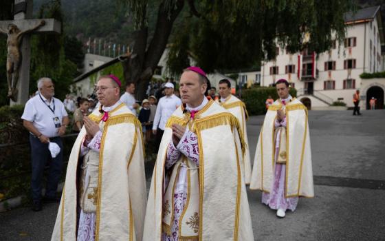 The newly consecrated SSPX bishops process to the seminary courtyard after the July1 consecration outside St. Pius X seminary, in Econe, Switzerland, July 1, 2026. (Courtesy of  Society of Saint Pius X)