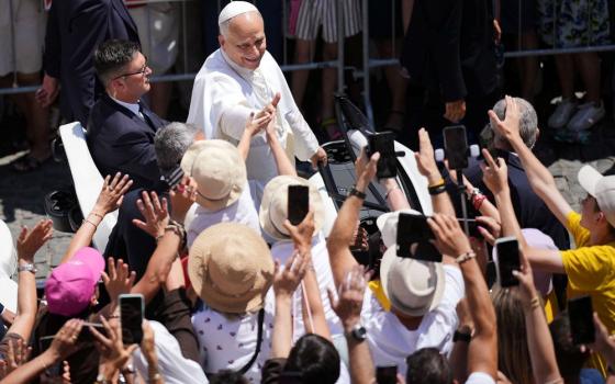 Pope Leo XIV greets the faithful gathered in the square in front of the Apostolic Palace for the noon Angelus prayer, in Castel Gandolfo, on the outskirts of Rome, July 12, 2026. (RNS/AP/Andrew Medichini)