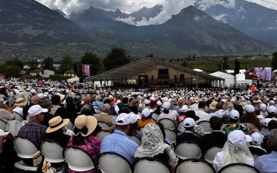 People attend a Mass for illicit bishop consecrations held at the international seminary for the Society of St. Pius X in Écône, Switzerland, July 1, 2026. Organizers said more than 16,000 people attended the Mass. (NCR photo/Justin McLellan)