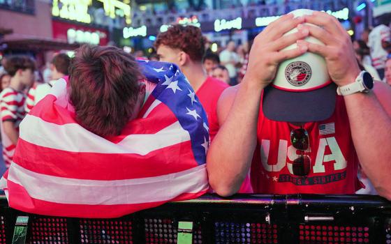 U.S. fans react in Portland, Ore., July 6, 2026, after the United States was eliminated from the FIFA World Cup. The United States men's national soccer team ended its run following a 4-1 defeat to Belgium in the teams' round of 16 game. (OSV News/Reuters/Denny Medley)