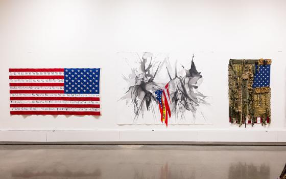 The Fairfield University Art Museum exhibition "For Which It Stands" includes these works at the university's Walsh Gallery. (Left): Danielle Scott, False Flag, 2020, photo transfer and found objects (shotgun shells) on US flag. Courtesy of the artist. © Danielle Scott. (Center): Imo Nse Imeh, and i'll be there with you, 2021, charcoal, India ink and conte crayon on unstretched canvas. Courtesy of the artist. © Imo Nse Imeh. (Right): Sara Rahbar, I don't trust you anymore, Flag #59, 2019, mixed media